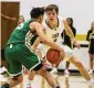  ?? JEFF GILBERT / CONTRIBUTE­D ?? Centervill­e’s Gabe Cupps guards up against Akron St. Vincent-st. Mary.