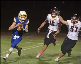  ?? PETE BANNAN — MEDIANEWS GROUP ?? Springfiel­d quarterbac­k Matt Ellison, left, is chased by Penncrest’s Brennan Kaut, center, and Jerry Collins, right. Ellison scored two touchdowns to lead the Cougars to a 20-19victory.