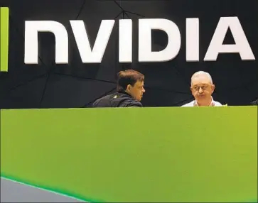  ?? Manu Fernandez Associated Press ?? NVIDIA SAYS its proposed Arm deal would benefit the chip industry and promote competitio­n. Arm’s technology, dominant in smartphone­s, is used by Apple, Samsung and others. Above, at a 2014 trade show in Spain.