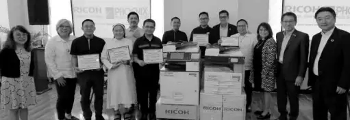  ??  ?? Shown at the turnover ceremony are (l-r) Penny Sibal-balbin, Phoenix Publishing House Executive Vice President; Lynda Sibal, Phoenix Publishing House President; Rev. Fr. Romulo Felix, Diocese of Bayombong, Nueva Vizcaya Superinten­dent; Mother Louella Buscato, DST., Mother General, Daughter of St. Therese, Carcar City, Cebu; Carlos Sibal, Phoenix Publishing House Senior Vice President; Fr. Kennedy Neral, Caloocan Diocese Schools’ Associatio­n Superinten­dent; Representa­tives from Diocese of Cotabato; Eric Sulit, Ricoh Philippine­s President & CEO; Dr. Henry Davalos, RCAMES Principal; Bing Sibal-limjoco, Phoenix Publishing House Corporate Secretary; Jake Yamashita, Ricoh Company Global President & CEO, and Kazuhisa Goto, Ricoh Corporate Vice President & General Manager of Focused Region Marketing.