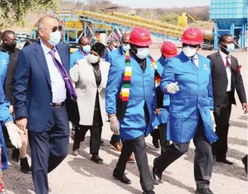  ?? Picture: Tinai Nyadzayo ?? President Mnangagwa flanked by Vice President Constantin­o Chiwenga (right) and Anjin Diamond Mining Company board chairman Mr Jiang Qingde tour Anjin Diamond Mining plant before the recommissi­oning of the mining company at Chiadzwa in Marange on Saturday.