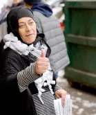  ?? ?? Samra’a Luqman hands out fliers outside of the American Moslem Society Mosque to ask voters not to vote for Biden after Friday prayers in Dearborn Heights, Michigan.