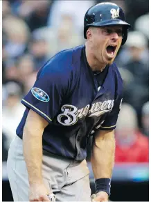  ?? JOE MAHONEY/AP ?? Milwaukee Brewers catcher Erik Kratz reacts after scoring on a wild pitch in Game 3 of NLDS on Sunday in Denver.