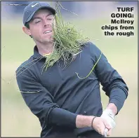  ??  ?? TURF GOING: McIlroy chips from the rough