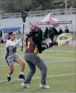  ??  ?? Nikolas Samuels
/The Signal (Above) Valencia’s Amanda Yamamoto (7) drives toward the opposing goal during a home game against Simi Valley on Friday. (Right) Valencia’s Kianna Shakir (12) guards the Simi Valley goaltender on Friday.