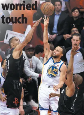  ?? AP PHOTO ?? Golden State Warriors guard Stephen Curry, right, takes a shot in front of Houston Rockets defender Gerald Green during Game 2 of the Western Conference finals this past Wednesday in Houston. Game 3 is on Sunday.