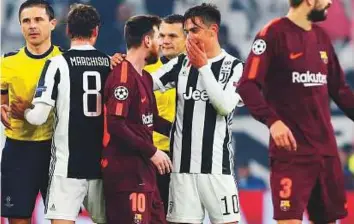  ?? AP ?? Juventus’ Paulo Dybala (second from right) talks to Barcelona’s Lionel Messi at the end of the Champions League Group D match at the Allianz Stadium in Turin on Wednesday.