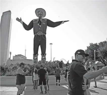 ?? PHOTOS BY BRYAN TERRY/THE OKLAHOMAN ?? The 2020 Red River Showdown did feature Big Tex, above, but the State Fair of Texas was canceled and attendance was limited to 25% for the game. This year, things return to normal with full attendance.