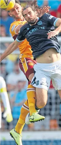  ??  ?? High moment for Dundee substitute Cillian Sheridan and Motherwell’s Ricki Lamie.