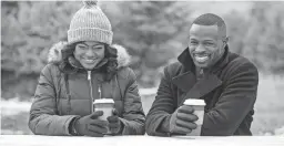  ??  ?? Tatyana Ali, left, and Sean Patrick Thomas appear in the Lifetime holiday movie, “Christmas Hotel.”