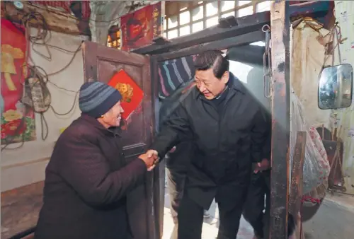  ?? LAN HONGGUANG / XINHUA ?? President Xi Jinping visits Tang Rongbin, a local resident who lives below the poverty line, during a tour of Fuping county, Hebei province.