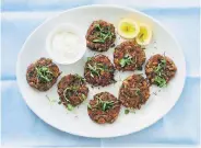  ?? Beatriz Da Costa, © The New York Times Co. ?? Yewande Komolafe’s crispy bean cakes with scallions and herbs.