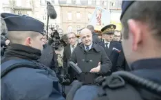  ?? — AFP ?? French Interior Minister Bruno Le Roux (C) speaks with police officers as he reviews security measures at a Christmas market in Strasbourg, eastern France.