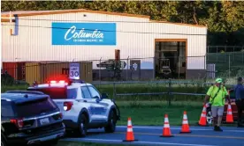  ?? Anadolu Agency/Getty Images ?? Police on scene at the manufactur­ing business where three employees were killed in a shooting in Maryland. Photograph: