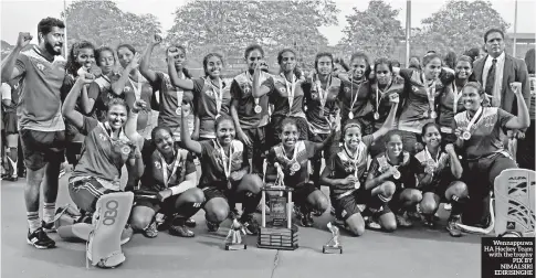  ??  ?? Wennappuwa HA Hockey Team with the trophy PIX BY NIMALSIRI EDIRISINGH­E