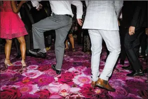  ?? (The New York Times/Philip Cheung) ?? Guests dance at a wedding in Piru, Calif., on Sept. 1, 2019. After months of couples postponing and paring down their wedding plans, the season of celebratin­g nuptials is finally in full swing again and DJs are in high demand but in short supply.