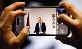  ?? Photograph: Clodagh Kilcoyne/Reuters ?? The Palestinia­n ambassador to Britain is seen on a mobile phone screen on Tuesday.