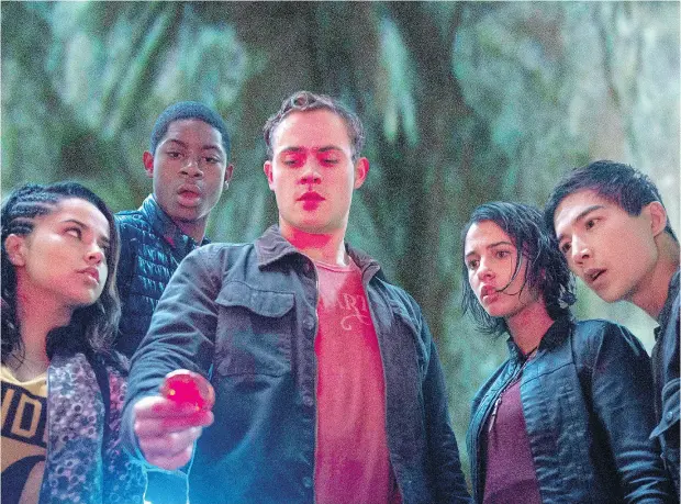  ?? PHOTOS: KIMBERLY FRENCH / LIONSGATE VIA THE ASSOCIATED PRESS ?? From left, Becky G, RJ Cyler, Dacre Montgomery, Naomi Scott and Ludi Lin are the newly empowered in Power Rangers.