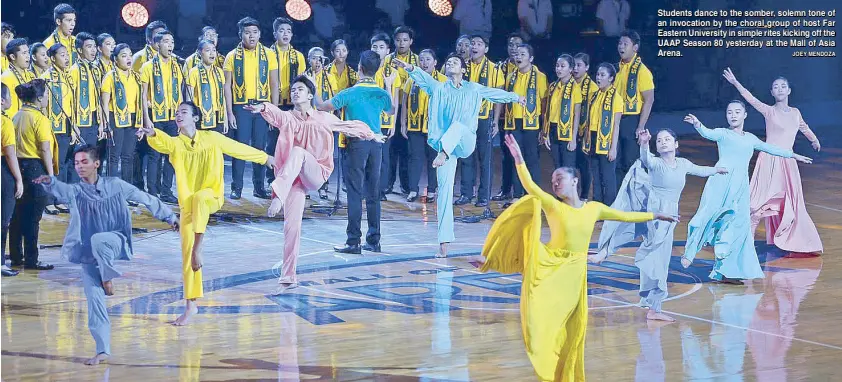  ??  ?? Students dance to the somber, solemn tone of an invocation by the choral group of host Far eastern University in simple rites kicking off the UAAP Season 80 yesterday at the Mall of Asia Arena. JoeY MeNDoZA