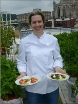  ?? Lake Fong/ Post- Gazette ?? Sonja Finn, owner and chef of Dinette in East Liberty, in the rooftop garden where she grows some of the vegetables and herbs for the restaurant, including eggplant for her eggplant pizza.