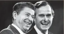  ?? AP FILE ?? THAT’S THE TICKET: President-elect Ronald Reagan, left, and Vice President-elect George Bush smile after their 1980 election.