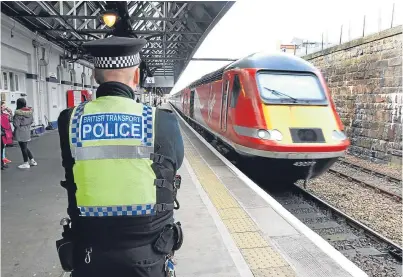  ??  ?? A British Transport Police officer on duty at Dundee railway station.