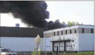  ?? Rob Fish / Contribute­d photo ?? A rooftop solar panel array caught fire Thursday in Danbury, sending plumes of black smoke into the air.
