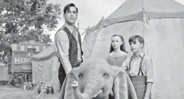  ?? — Walt Disney Pictures ?? Farrell (left to right), Nico Parker and Finley Hobbins star as a family who takes care of the baby elephant in ‘Dumbo’. In this remake, none of the animals utter a word.