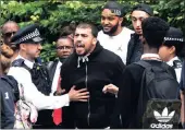  ?? PICTURE: EPA ?? A resident reacts with anger close to the scene of the blaze. Authoritie­s are being blamed for not ensuring proper building standards were in force at the tower block that housed mainly immigrants.