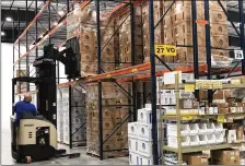  ?? LAWRENCE BUDD/STAFF ?? Steve Smith, shipping manager for Hardy Diagnostic­s, moves inventory in an expanded area of the company’s facilities in Springboro.