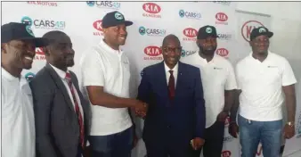  ??  ?? Vice President, Business Developmen­t, Kia Motors Nigeria, Mr. Olu Tikolo (third from Right) in handshake with Cars45 CEO, after the signing of a sales deal between them. With them are the Marketing Manager, Kia Motors Nigeria, Mr. Jimoh Olawale (second...