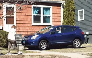  ?? Tyler Sizemore / Hearst Connecticu­t Media ?? A car is parked on the front lawn of a private residence in Stamford. Proposed mobility changes have been presented before the zoning board and could reconfigur­e traffic, bikes and parking throughout the city.