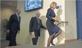  ?? [MOLLY RILEY/THE ASSOCIATED PRESS] ?? Education Secretary Betsy DeVos, followed by acting Secretary Phil Rosenfelat and her husband Dick DeVos Jr., left, arrives to address department staff Wednesday at the Education Department in Washington.