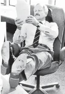  ??  ?? Smile time: Finance Minister Roger Douglas relaxes in his Beehive office running over his Budget speech before delivering it in the House in this 1986 file photo.