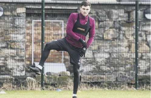  ??  ?? Hearts defender John Souttar limbers up yesterday as he prepares to face St Johnstone in today’s Scottish Cup fifth-round clash.