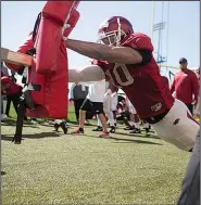  ?? NWA Democrat-Gazette/CHARLIE KAIJO ?? Arkansas Razorbacks linebacker Randy Ramsey performs drills during practice March 3 at the University of Arkansas, Fayettevil­le.