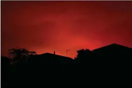  ?? @AVATHEHUMA­N ?? This Tuesday photo provided by Twitter user @AvaTheHuma­n shows a red sky from wildfires burning, in Victoria, Australia.