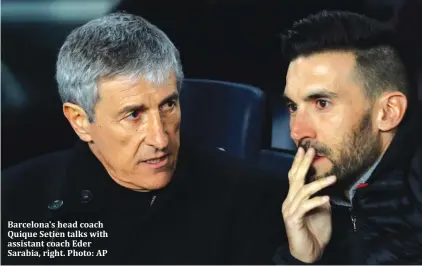  ??  ?? Barcelona's head coach Quique Setien talks with assistant coach Eder Sarabia, right. Photo: AP