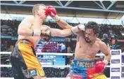  ??  ?? Jeff Horn and Manny Pacquiao go toe to toe.