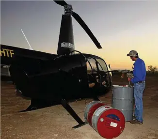  ?? PHOTO: JOHN ANDERSEN ?? GIVING THANKS: Patrick Schaf wrote a poem about chopper pilots, like Harry Terry from Forsayth, helping out in the floods.