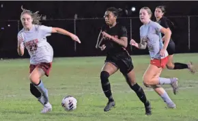  ?? ?? Palm Beach Gardens’ Noelle Simmons dribbles the ball downfield, looking for space against Centennial on Wednesday.