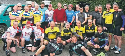  ??  ?? Rob Wainwright, back, with the team of virtual marathon challenger­s and Mary’s Meals founder Magnus MacFarlane-Barrow, centre back.