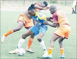  ?? (Pic: Sanele Jele) ?? Denver Sundowns’ Alvin Shabashie (C) shields the ball away from Young Buffaloes’ Sandile ‘Saviola’ Gamedze (L) and Fanelo ‘Order’ Mamba. Buffaloes won 1-0 during the MTN Premier League match played at KaLanga Technical Centre yesterday.