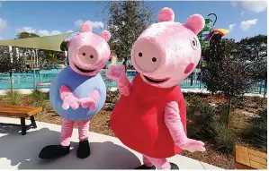  ?? (Ricardo Ramirez Buxeda/Orlando Sentinel/TNS) ?? George and Peppa Pig characters pose on Feb. 16 during the media preview of Peppa Pig Theme Park.