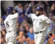  ?? CAYLOR ARNOLD, USA TODAY SPORTS ?? Eric Thames, right, gives Ryan Braun some credit for his hot start at the plate.