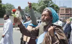  ?? — AFP ?? An Afghan peace activist shouts slogans in demand to an end to the war during a march from Helmand as he arrives in Kabul on Monday.