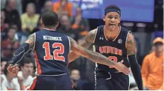  ?? CHRISTOPHE­R HANEWINCKE­L/ USA TODAY ?? Bryce Brown and J’Von McCormick have celebrated a lot in an 8-game run capped with Auburn’s SEC tournament title.