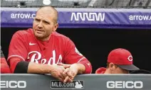  ?? DAVID ZALUBOWSKI/ASSOCIATED PRESS ?? Cincinnati Reds’ Joey Votto looks on from the dugout in the seventh inning of a baseball game against the Colorado Rockies, Sunday, in Denver.