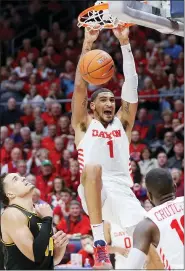  ?? JOHN MINCHILLO — THE ASSOCIATED PRESS FILE ?? Dayton’s Obi Toppin (1) dunks earlier this season against Virginia Commonweal­th. Toppin has been voted the AP men’s college basketball player of the year.