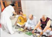  ?? HT FILE ?? BJP chief Amit Shah (centre) and Haryana chief minister Manohar Lal Khattar (right) with state party chief Subhash Barala had lunch at a Dalit party worker’s home in Rohtak on Friday.